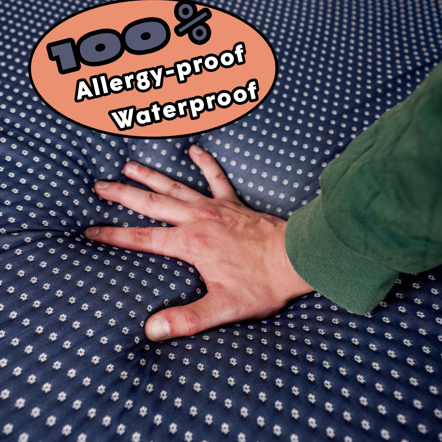 Hand pressing into Cornell Bigger Bed memory foam topper with 100% allergy-proof and waterproof cover.